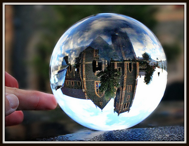 Photo of a cathedral being reflected in a crystal ball