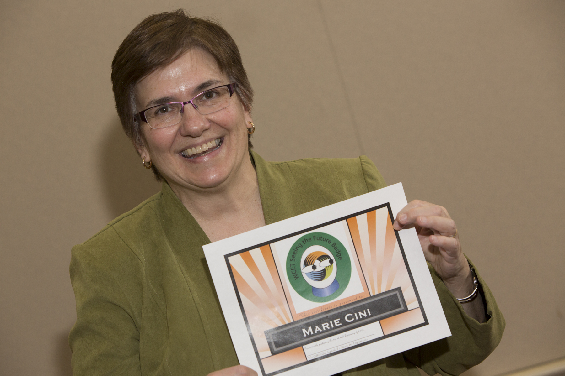 Photo of Marie Cini with "Seeing the Future Certificate