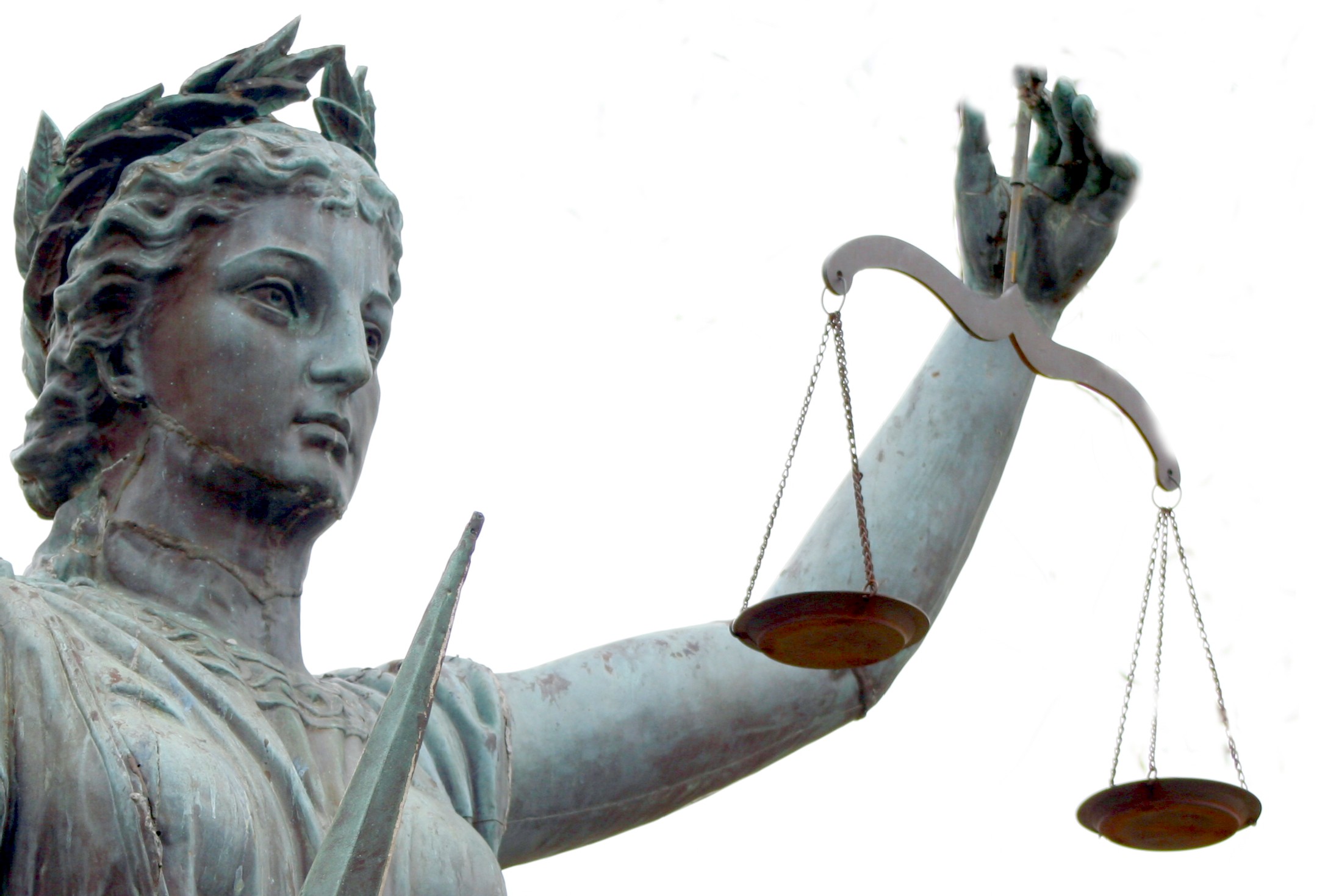 A statue of Justice holding scales in balance.