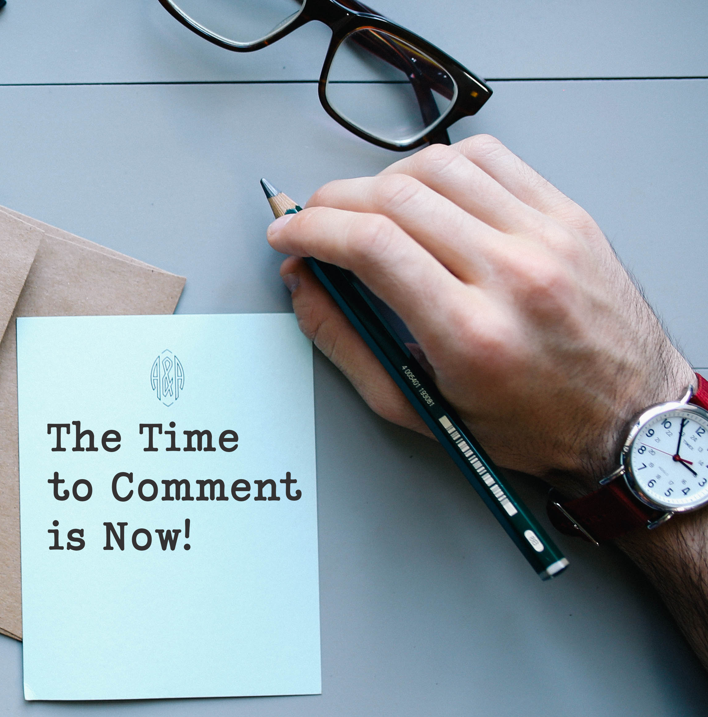 Picture of a hand with a watch and a pen. The words "The Time to Comment is Now" appears on a letter presumably being written by the person in the photo.