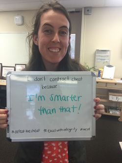 Woman holding white board saying "I don't contract cheat because I'm smarter than that!"