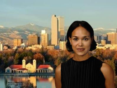 Young woman standing in front of a city landscape.