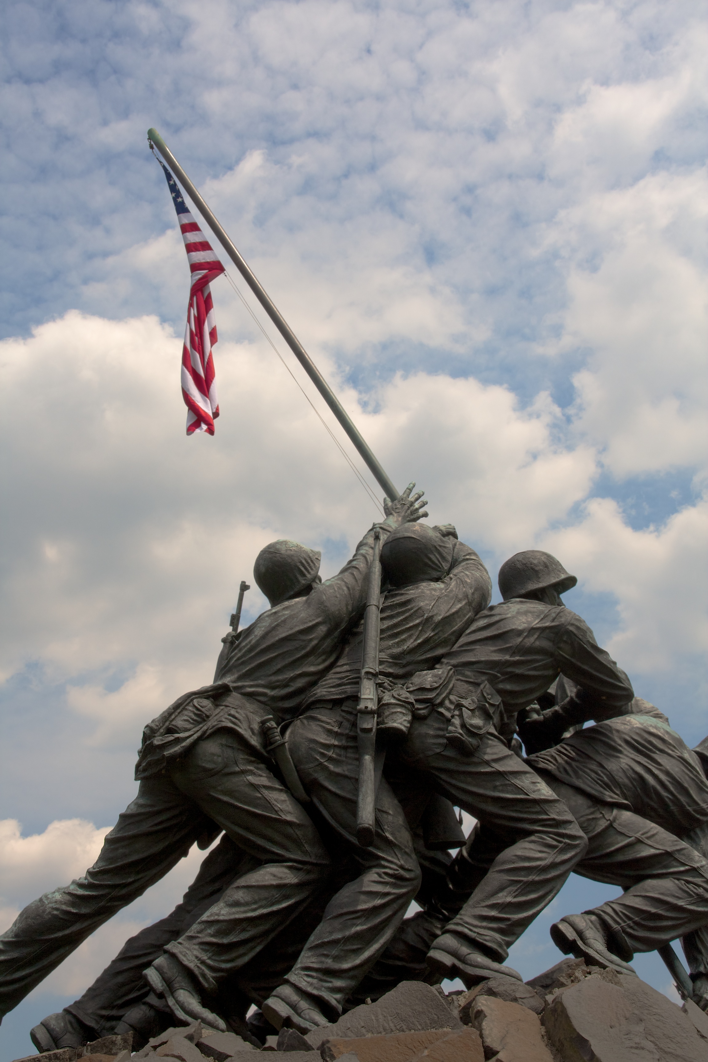 Iwo Jima statue of marines raising a flag on the top of a mountain.