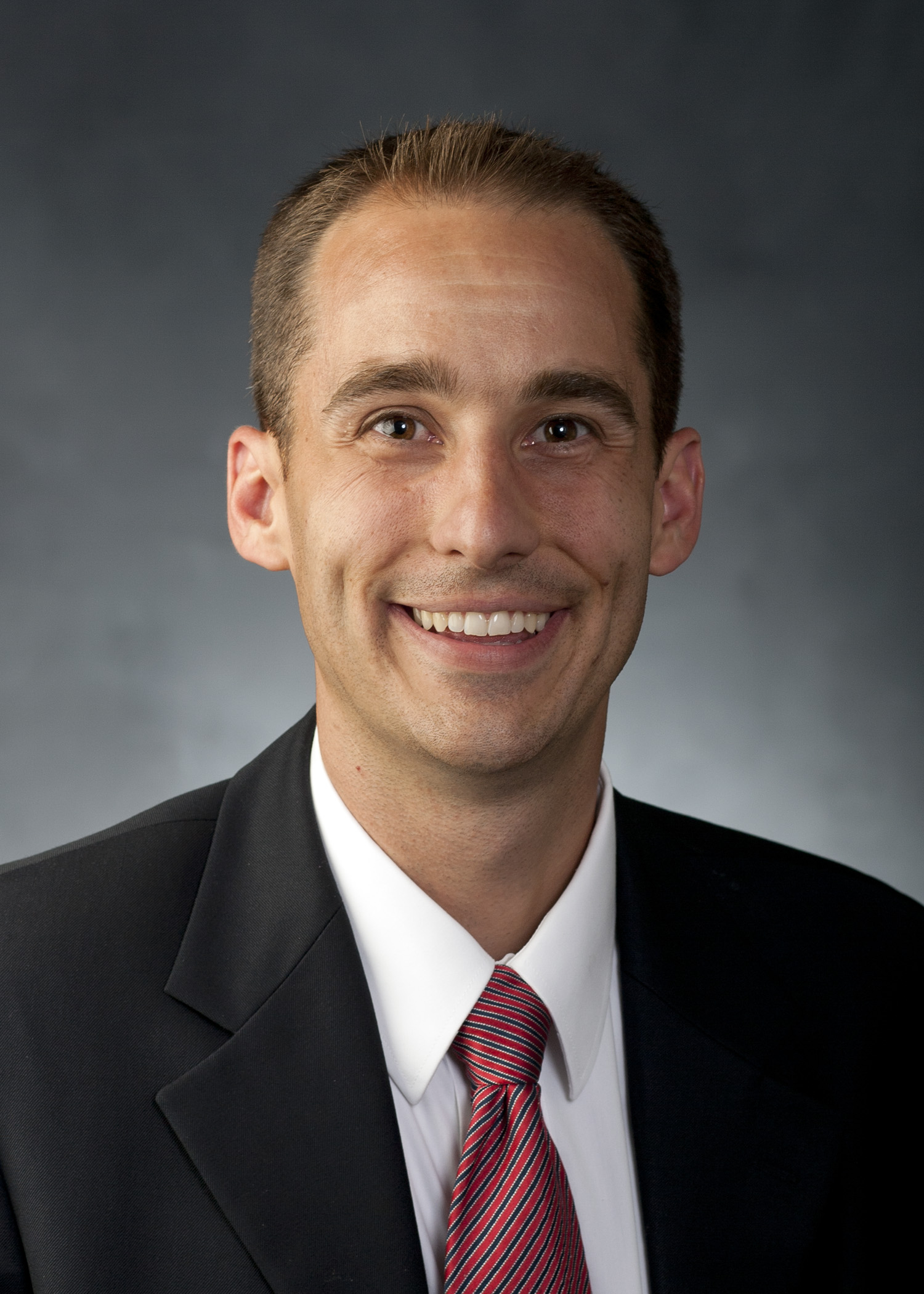 author headshot photo. Man smiling into the camera.