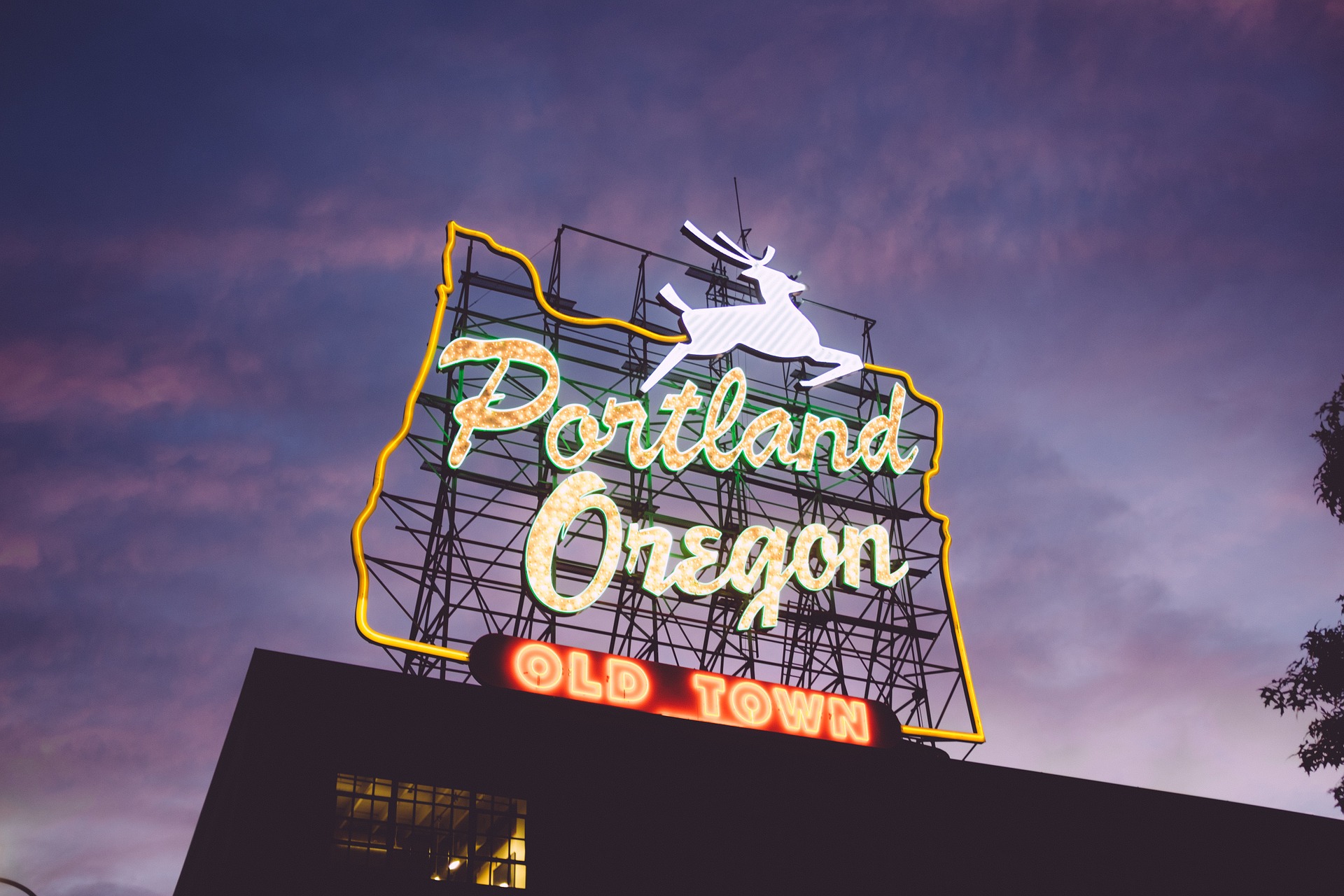 Old Town neon sign in Portland with the deer jumping over the words portland oregon