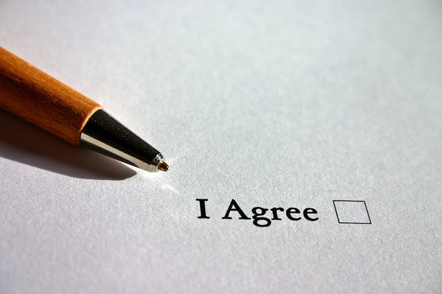 Picture of a sheet of white paper that reads, "I agree" which a blank box to check to the right.