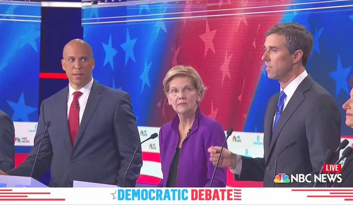 Senators Booker and Warren watch Beto O'Rourke at one of the 2019 democratic debates