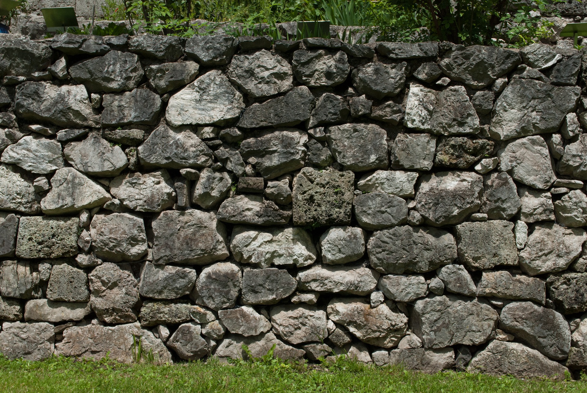 a grey stone garden wall