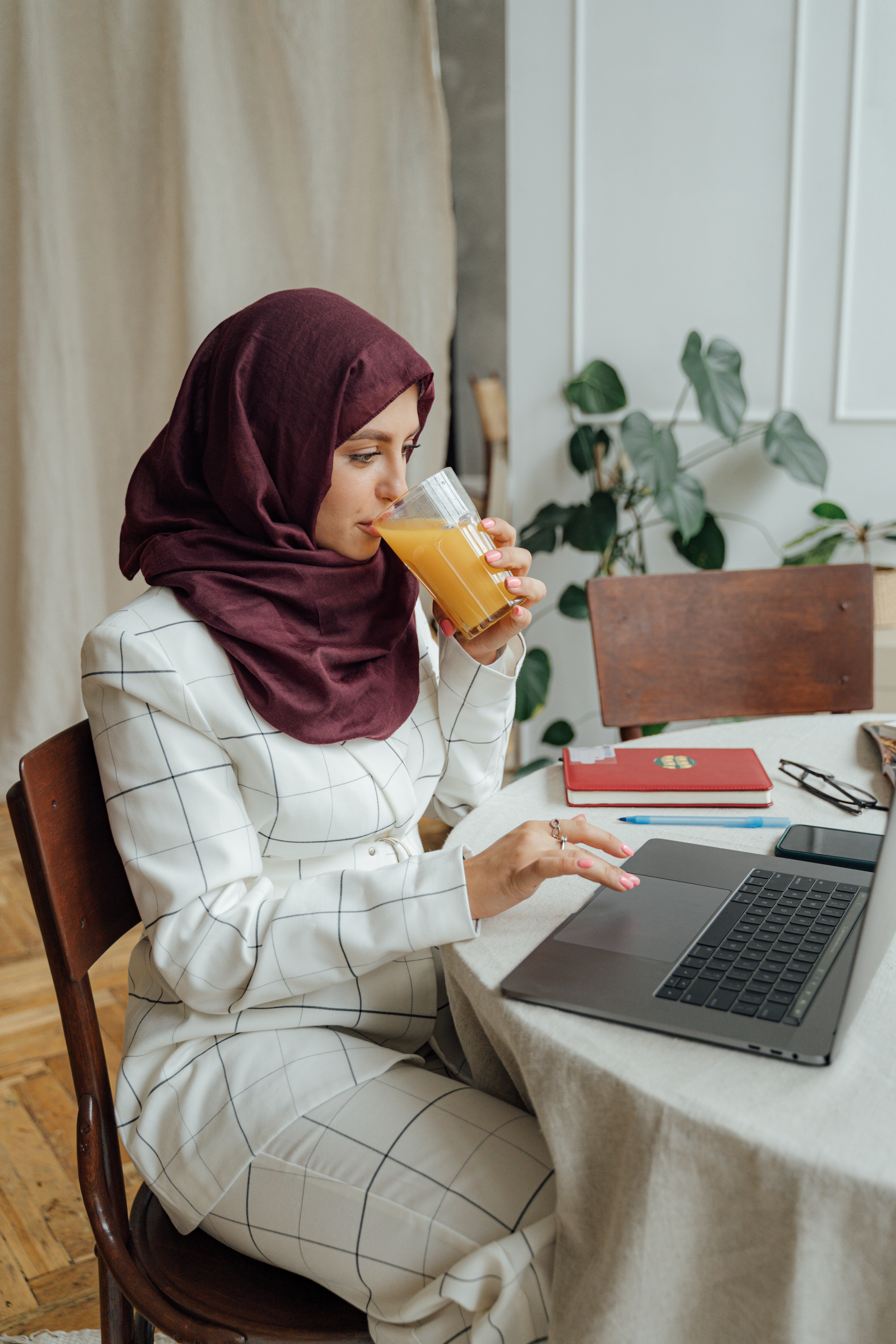 woman in a hijab on a laptop