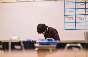 a student reading in a classroom