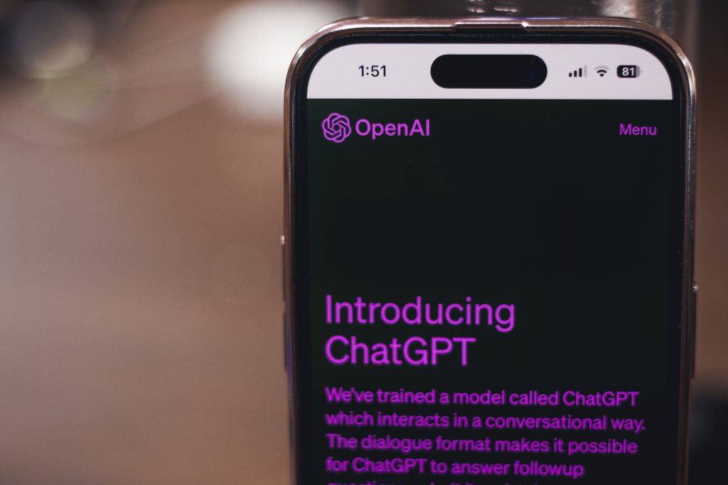 A smartphone with a brief introduction of ChatGPT on it.