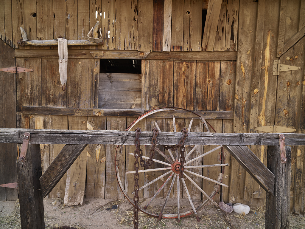 Example of an old west hitching post - a wooden stand one could use to tie up and leave horses.