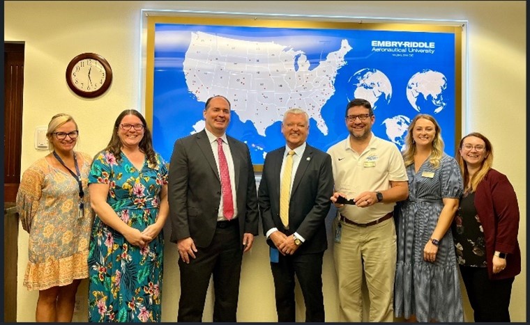 Photo of The Embry-Riddle Aeronautical University team-left to right: Ashley Toews, Nicole Wallace, Kelly Austin, John Watret, Will Miller, Katelyn Nelson, Danielle Farris, Will Miller, and Katelyn Nelson.