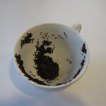 teacup showing tea leaves