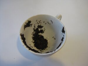 teacup showing tea leaves